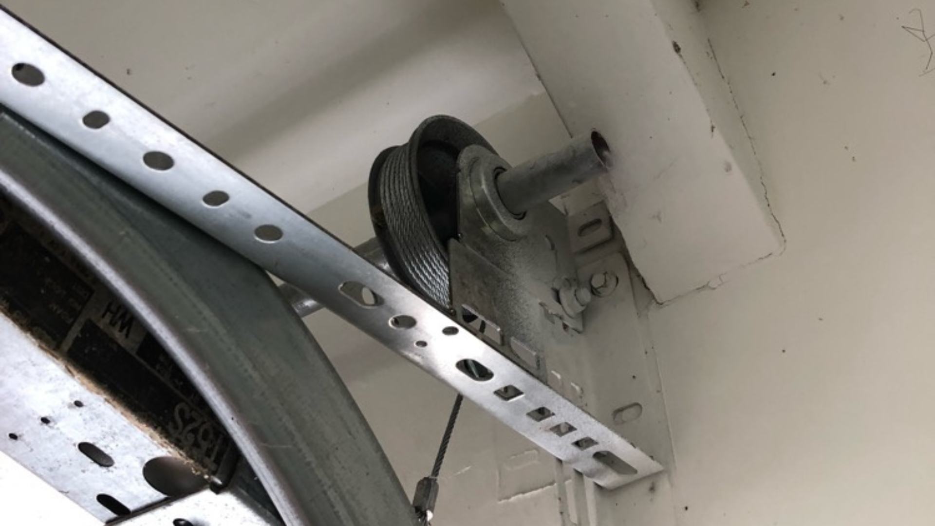 A garage door cable properly wound in its drum