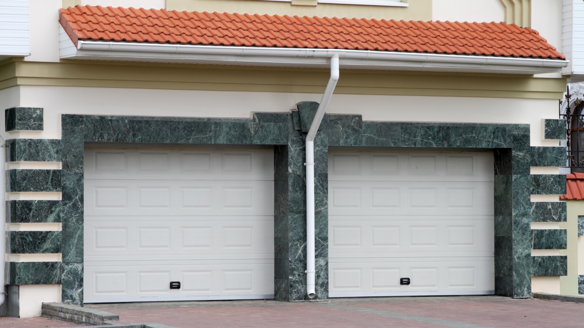A garage with two custom doors