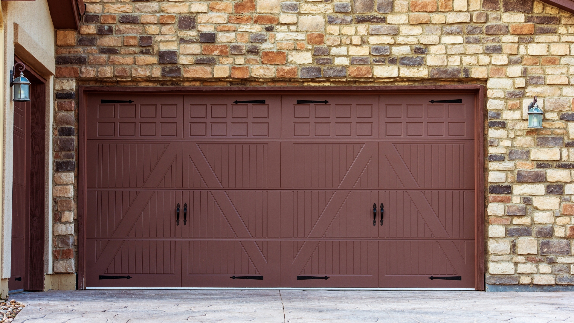 A custom garage door with decorative hardware