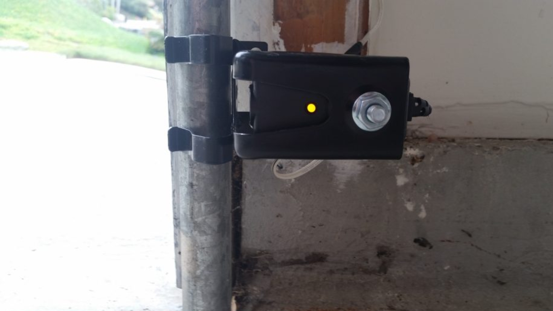 A working garage door safety sensor