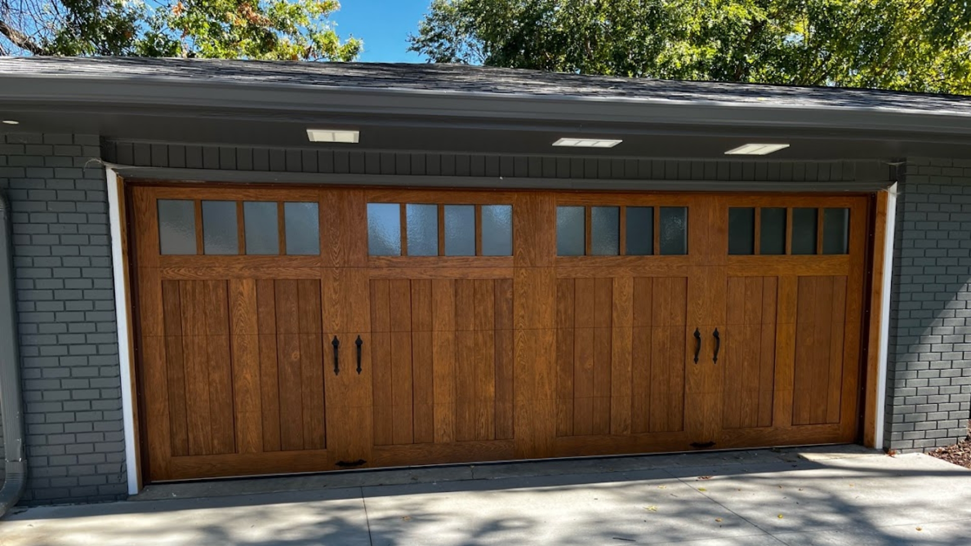 Wood composite doors with garage door windows
