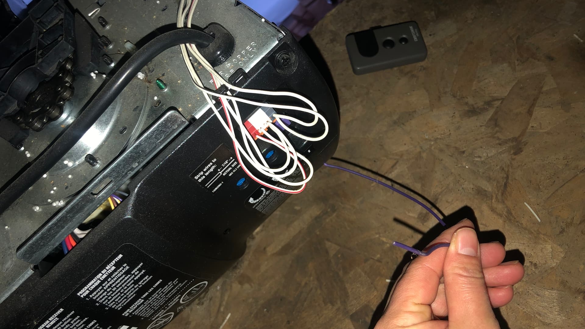 A homeowner troubleshooting potential garage door electrical problems