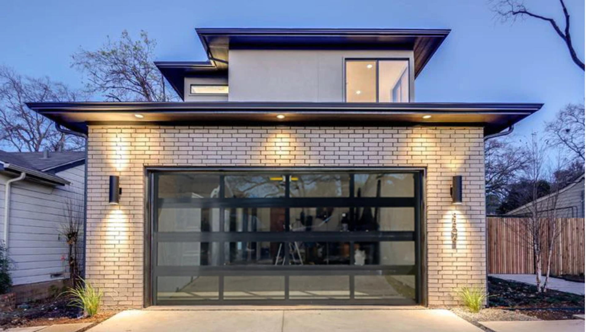 A house with glass garage doors
