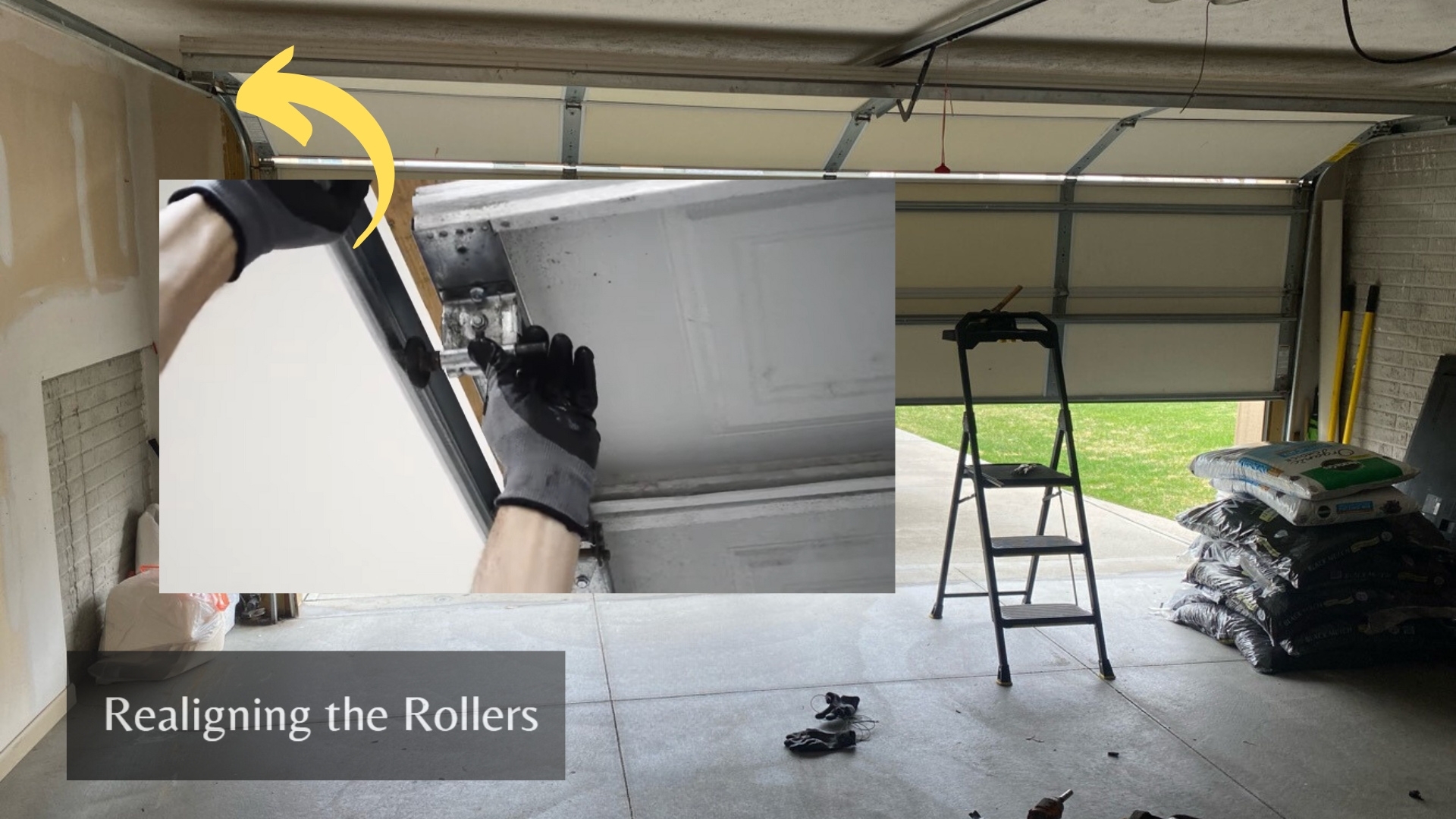 A man fixing the garage door by realigning the rollers