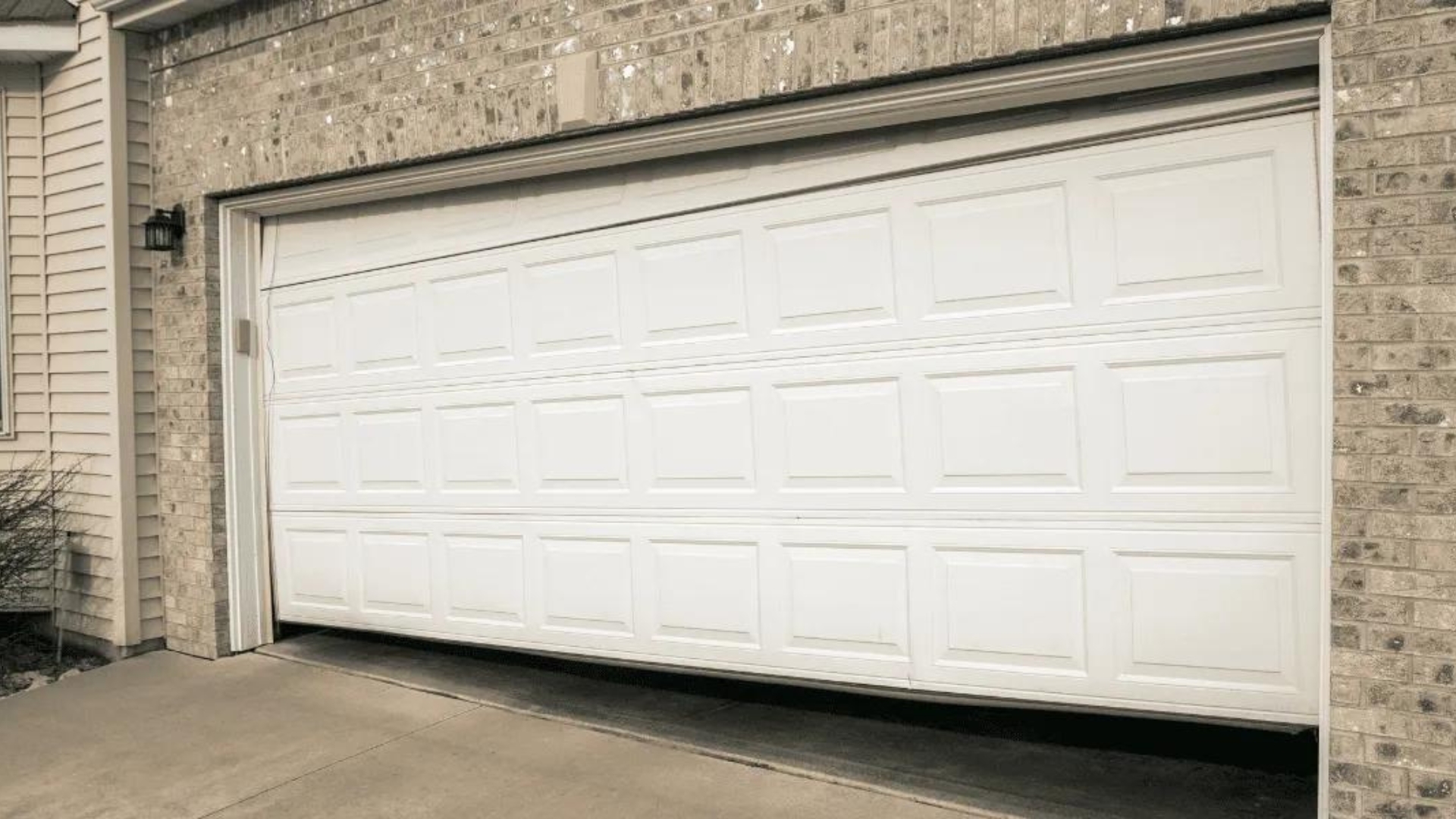 A misaligned garage door