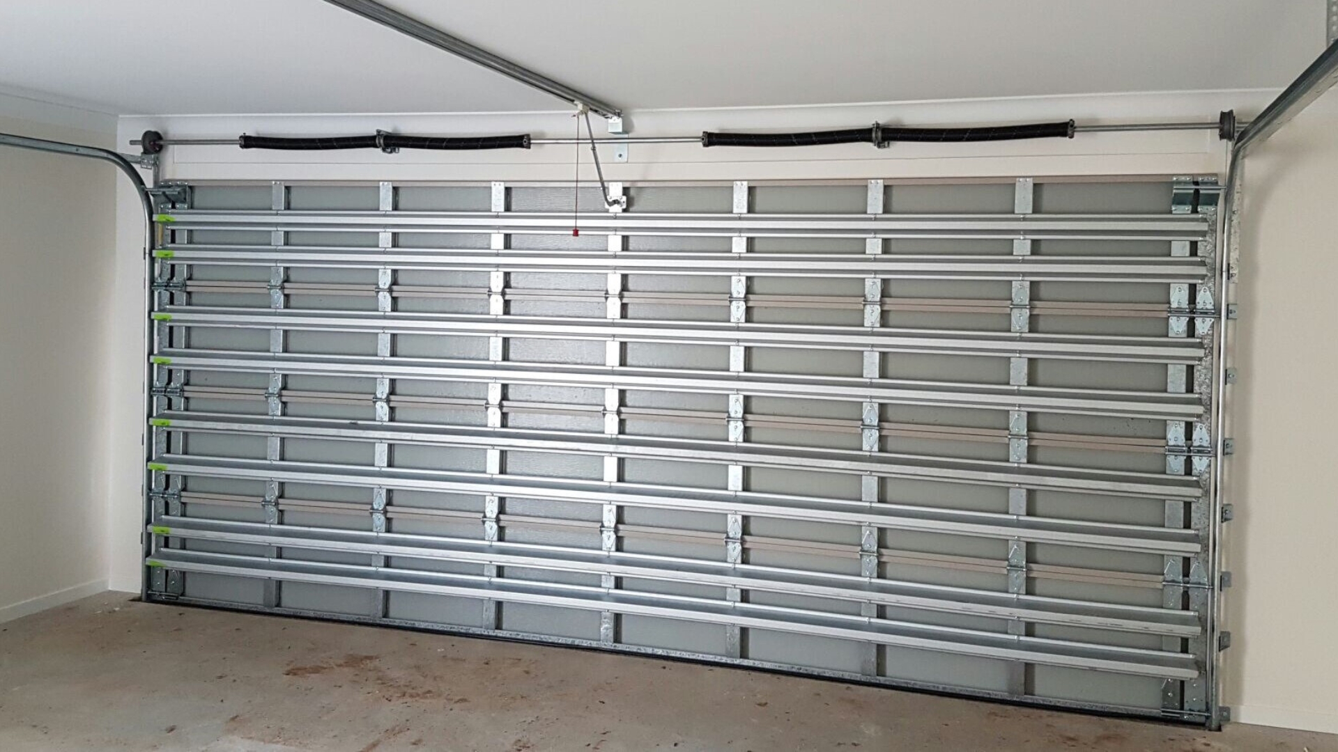 An impact-rated garage door installed in a home