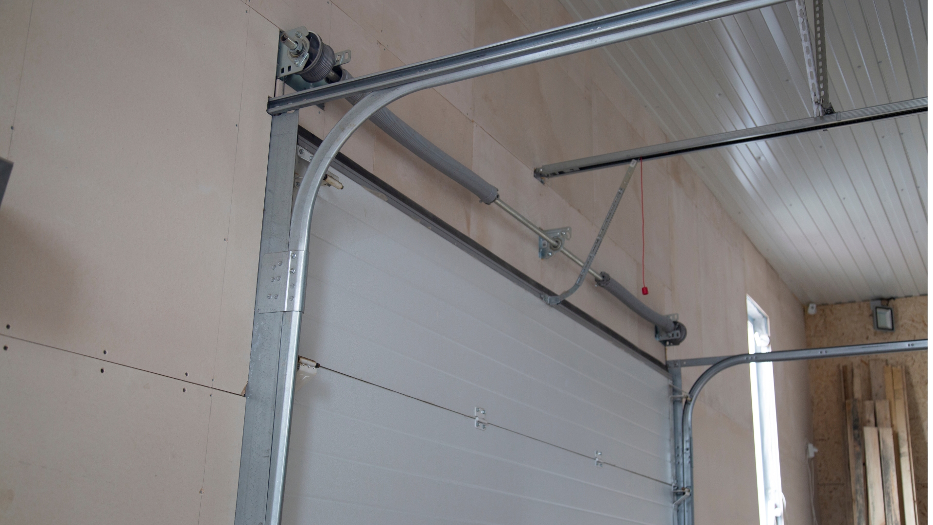 Garage door track repair project in Carter Lake, Iowa