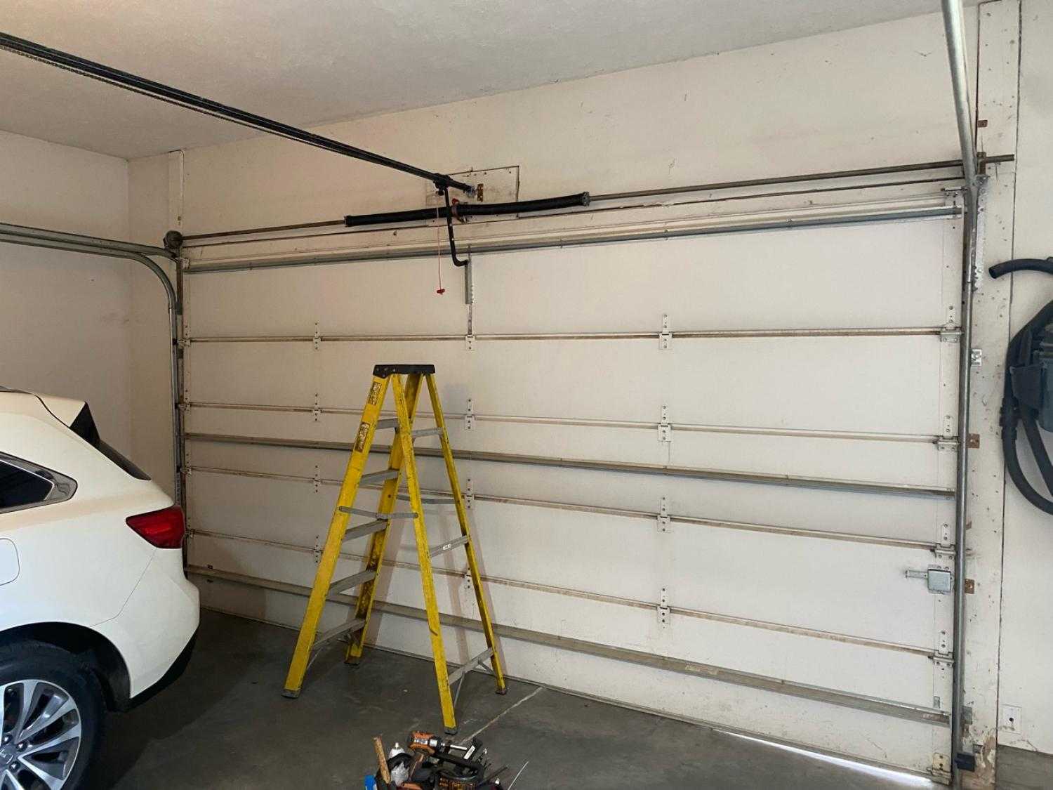 emergency garage door repair garage door service garage door spring replacement garage door spring snapped broken torsion spring Garage Spring Repair State St, Ralston, NE
