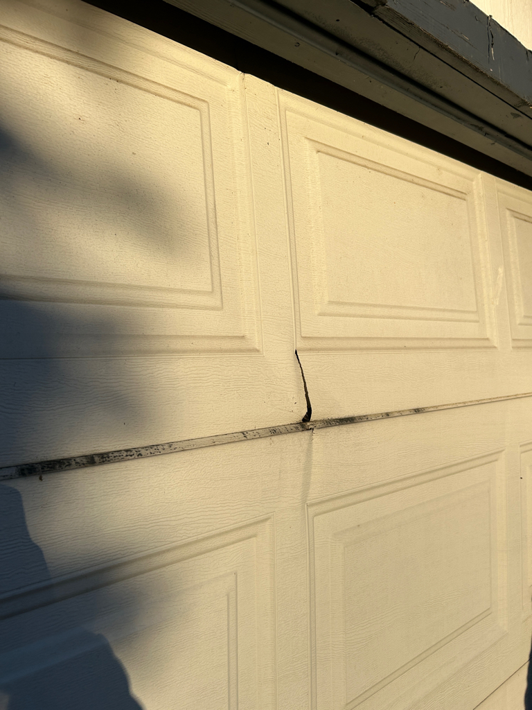 Garage door panel repair