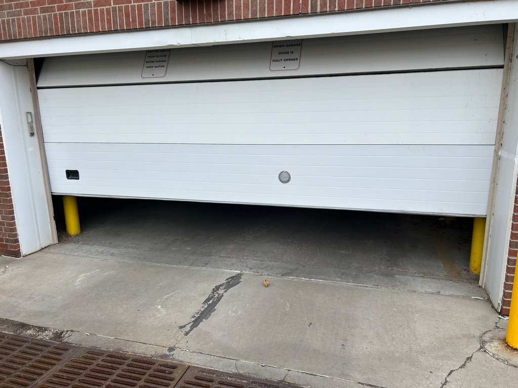 Garage door won't open because the commercial overhead door is stuck.