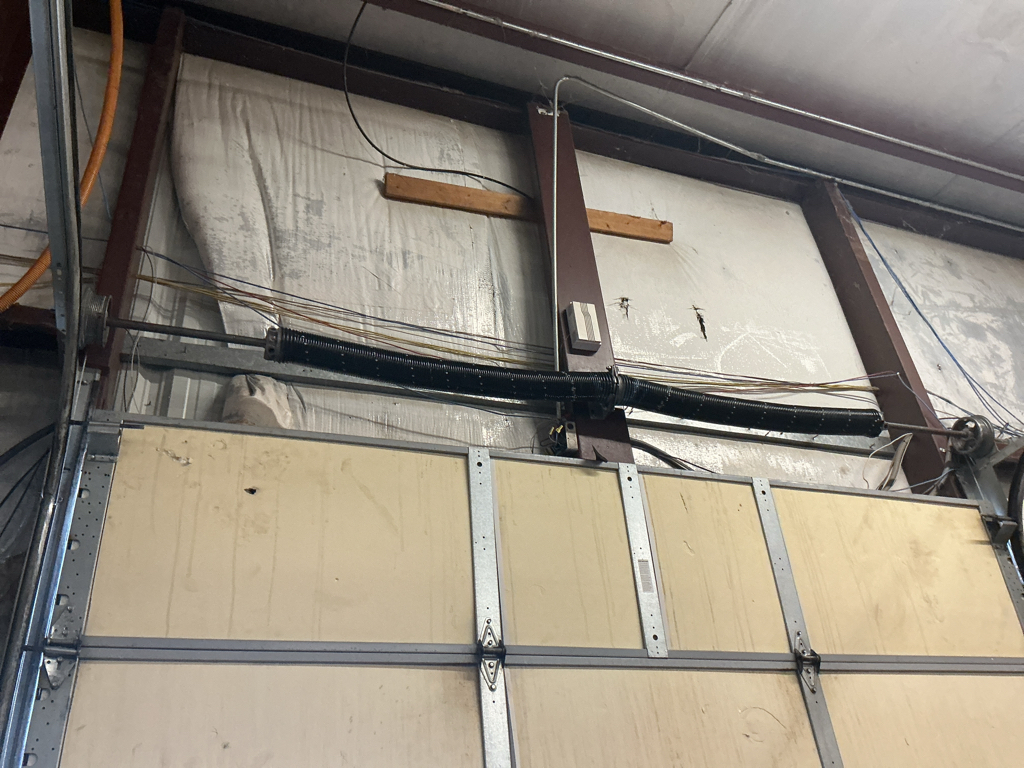 Commercial garage door service for an overhead sectional door in Omaha, Nebraska