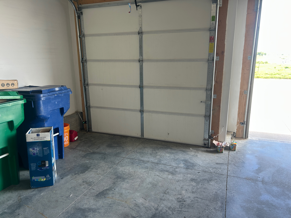 Garage door tune-up for an older residential sectional garage door