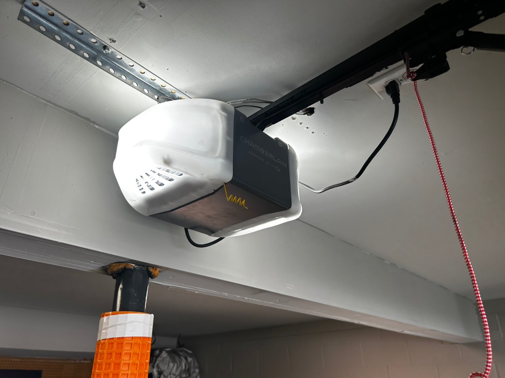 Garage door opener installation with overhead rail system