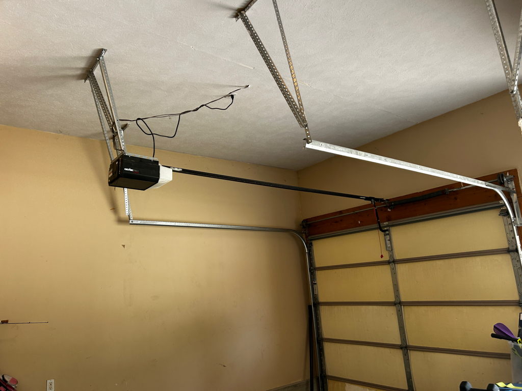 Garage door opener installation on a sectional garage door